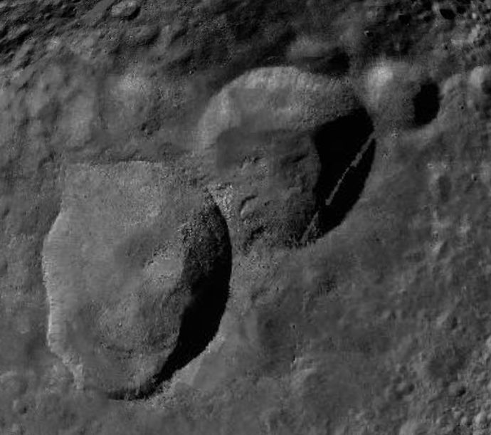 Three craters, Marcia, Calpurnia and Minucia, form a distinctive snowman shape on Vesta